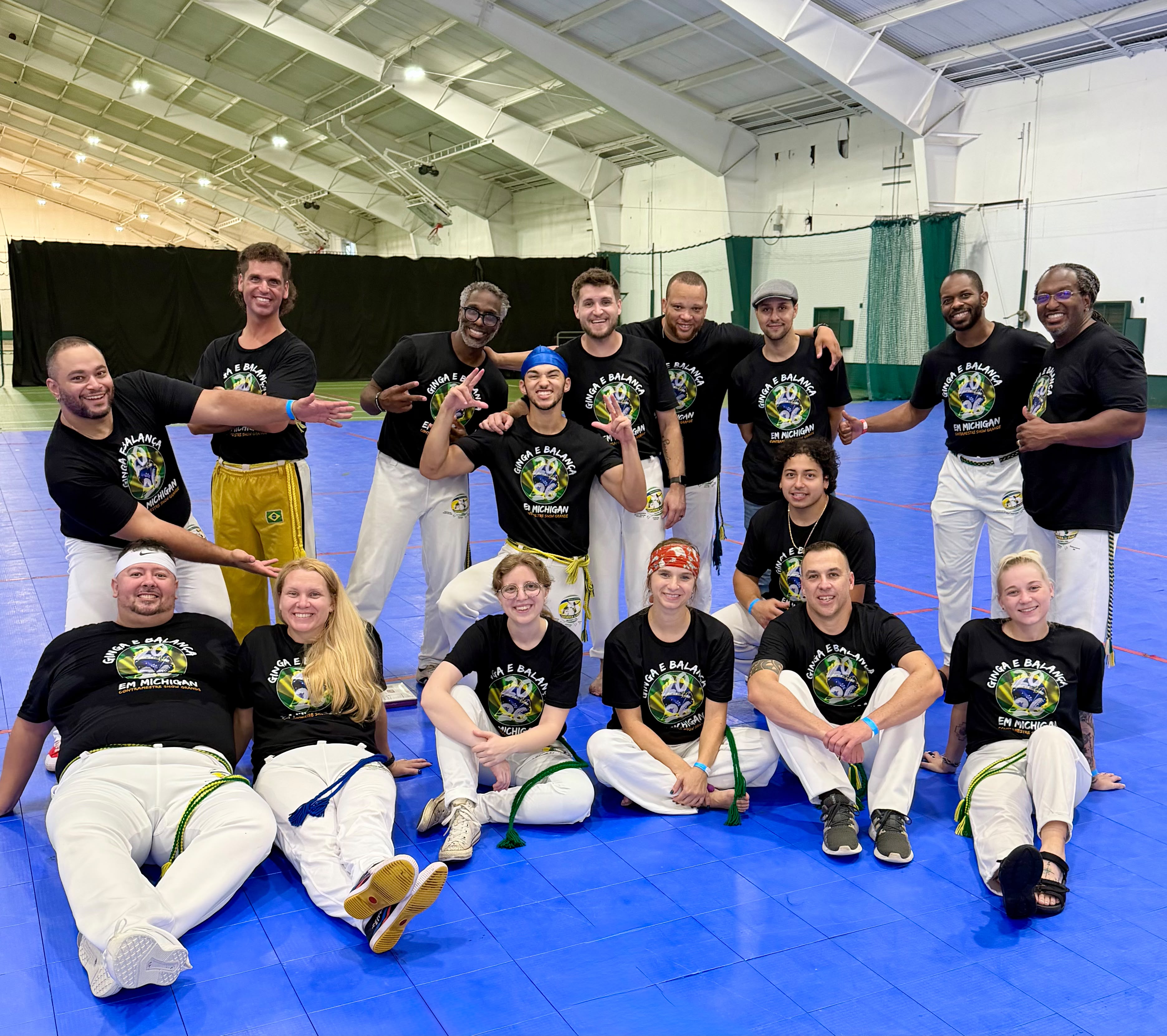 A Capoeira community participating in the roda